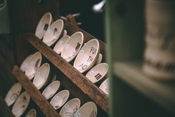 Photo of Saucers on Wooden Rack