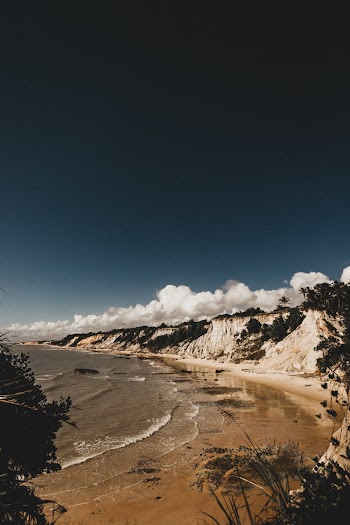 Photo of Seashore Under Blue Sky