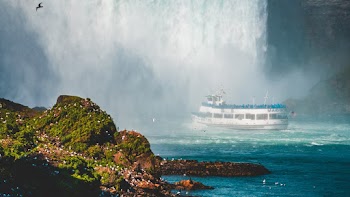 Photo of Ship Near Waterfalls