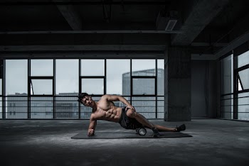 Photo of Shirtless Man Doing Yoga