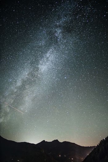 photo of silhouette mountain and stars