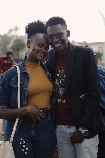 Photo of Smiling Couple Posing Together 
