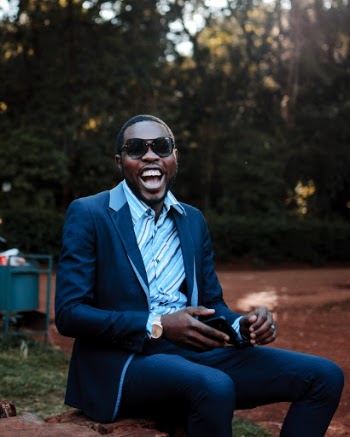 Photo of Smiling Man Wearing Suit