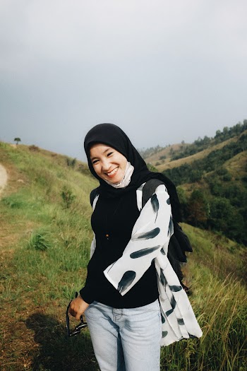 Photo of Smiling Woman in Black Hijab Posing