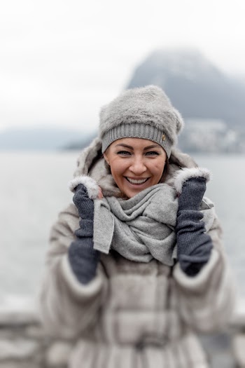 Photo of Smiling Woman in Winter Clothing