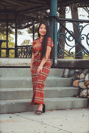Photo of Smiling Woman Standing Outside the Gazebo Posing
