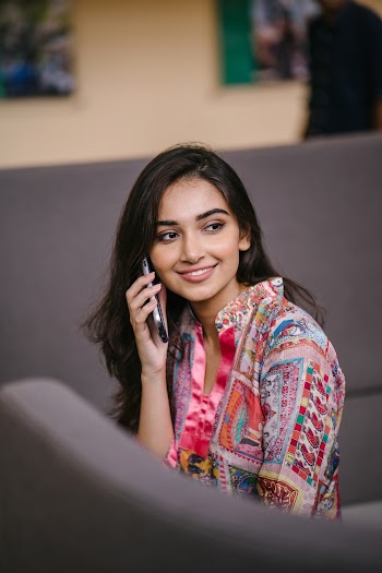 Photo of Smiling Woman Talking on Phone