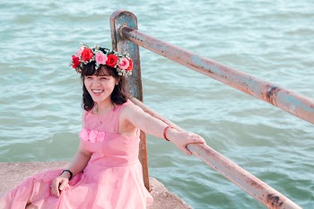 Photo of Smiling Woman Wearing Pink Gown