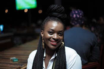 Photo of Smiling Woman Wearing White Collared Shirt