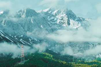 Photo of Snow Capped Mountain Covered by Fog
