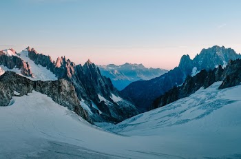 Photo Of Snow Capped Mountains During Dawn 
