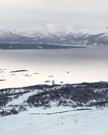 Photo of Snow Capped Mountains Near Lake