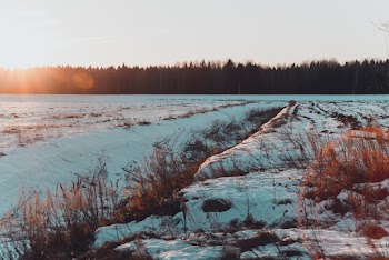Photo Of Snow Covered Field During Dawn 