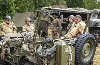 Photo of Soldiers Standing Near Military Vehicle