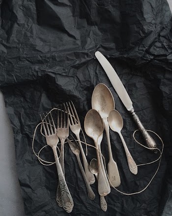 Photo of Stainless Steel Cutlery on Black Cloth