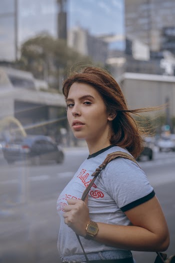 Photo of Standing Woman Carrying Bag