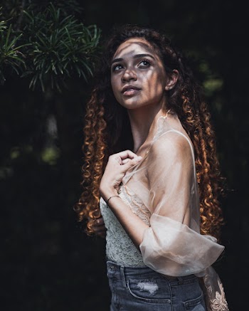 Photo of Standing Woman Posing While Looking up
