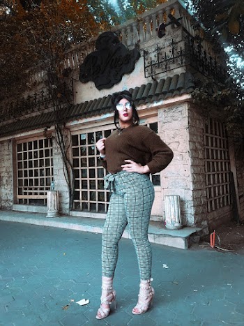 Photo of Standing Woman Wearing Sunglasses 