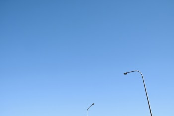 Photo of Street Lights Against Blue Sky