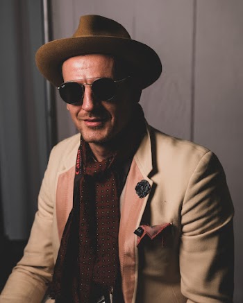 Photo of Stylish Smiling Man Posing