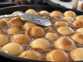 Photo of Sufganiyah being deep fried 