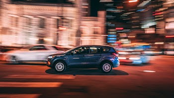 Photo of  SUV on Road during Night Time