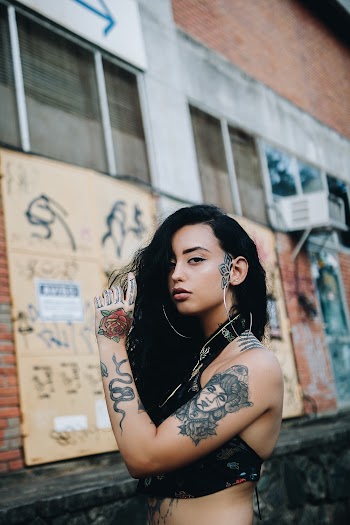 Photo of Tattooed Woman Posing