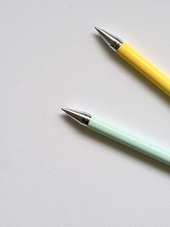 Photo of Teal and Yellow Point Pens