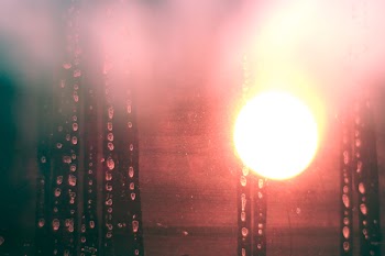 Photo of the Sun Through a Wet Window