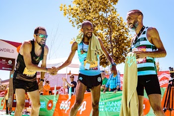 Photo of Three Runners Standing 