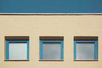 photo of three teal framed windows