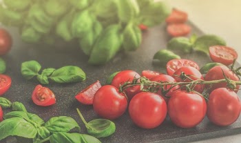 Photo of Tomatoes Near Green Leaves