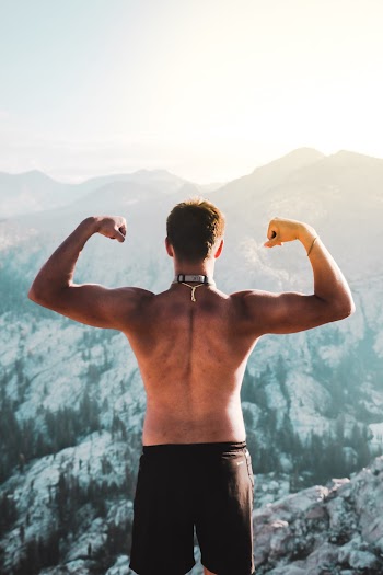Photo of Topless Man Wearing Black Shorts