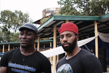 Photo of Two Men Wearing Black Shirts