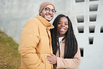 Photo of Two People Smiling