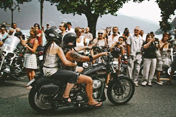 Photo of Two Persons Driving Motorcycle
