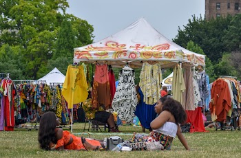 Photo of Two Women Lying on the Ground