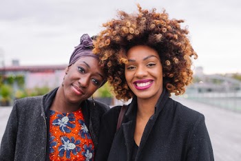 Photo of Two Women Smiling