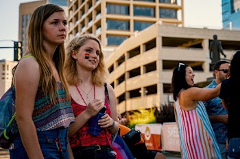 Photo of Two Women Standing Near Building