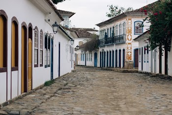 Photo of Unpaved Road Near Houses
