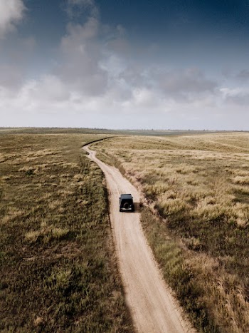 Photo of Vehicle on Dirt Road