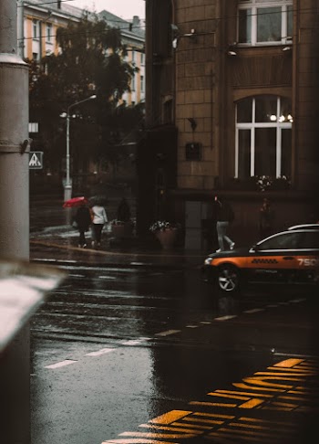 Photo of Vehicle on Street While Raining