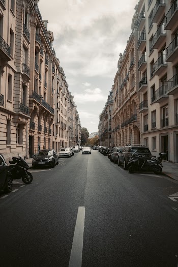 Photo of Vehicles on Road Near Buildings