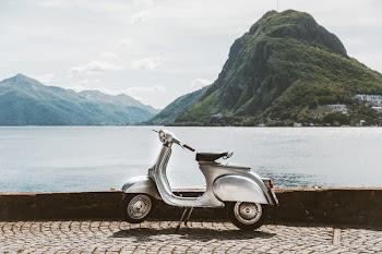 Photo of Vespa Scooter Near Body Of Water