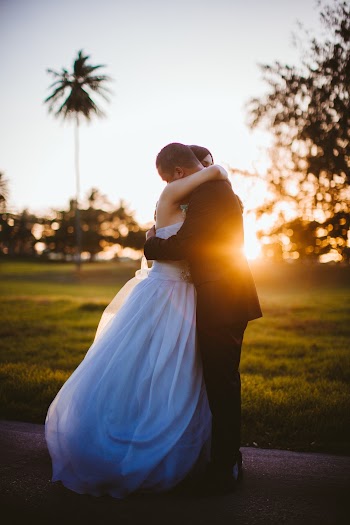 Photo of Wedded Couple Hugging