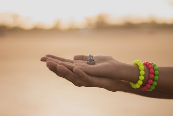Photo of Wedding Bands on Person's Hand