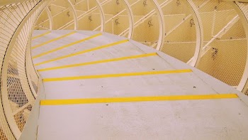 photo of white and yellow concrete stairs