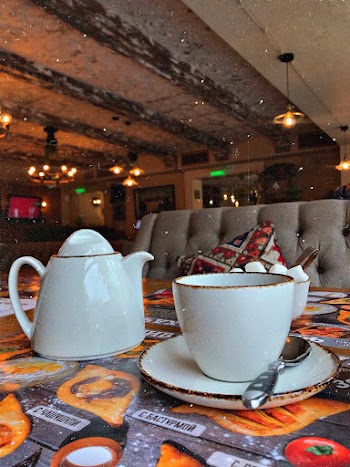 Photo of White Ceramic Cup and Pot on Table
