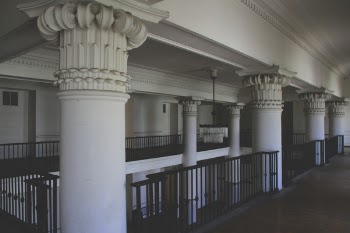 Photo of White Columns Near Railings