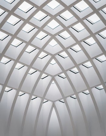 photo of white concrete building interior